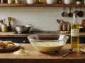 Préparation de crêpes : pâte dans un bol, pile de crêpes, et une bouteille d'huile d'olive. Quelle huile pour les crêpes ? L'huile d'olive est une option.